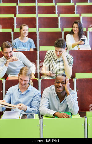 Happy group of students having fun in university lecture Stock Photo