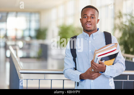African student with text books in university Stock Photo