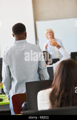 Pupils or students learn in seminar class with teacher Stock Photo