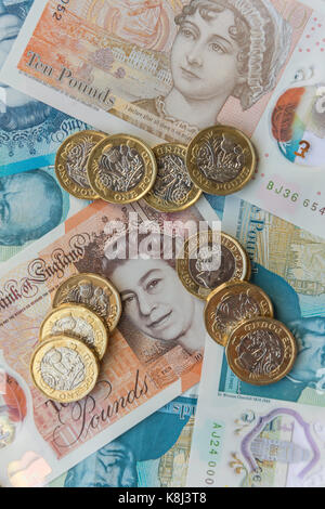 New British currency (one pound coins, five pound and ten pound notes, London, England, United Kingdom Stock Photo