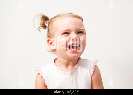 Beautiful expressive adorable happy cute laughing smiling baby infant face Stock Photo