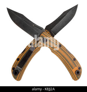 Two folding pocket knife with black crossed blade and yellow handle on white background Stock Photo