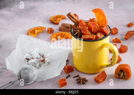 Pumpkin candy halloween sweets in yellow cup. Stock Photo