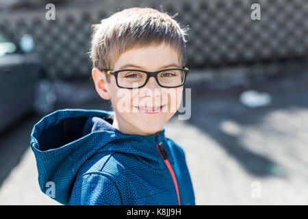 Portrait of a happy little boy outdoors Stock Photo