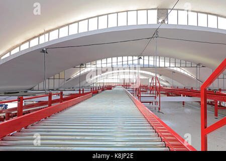 Conveyor Rollers in Shipping Distribution Warehouse Stock Photo