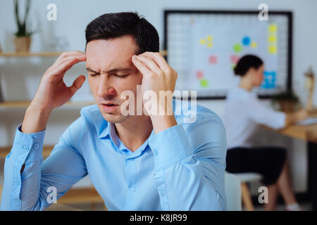 Concentrated man being deep in thoughts Stock Photo