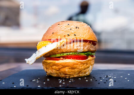 Delicious restaurant hamburger with fried egg Stock Photo