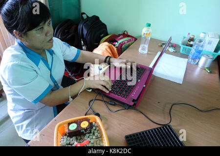 Vietnam. center for blind children. girl using a computer. Stock Photo