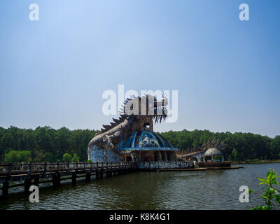 Hue, Vietnam - September 13 2017: Huge dragon in aquarium building in abandoned water park in Hue, Vietnam. Dragon structure Stock Photo