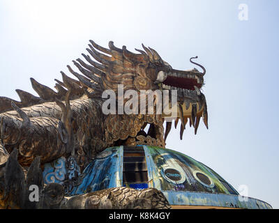 Hue, Vietnam - September 13 2017: Huge dragon in aquarium building in abandoned water park in Hue, Vietnam. Dragon structure Stock Photo