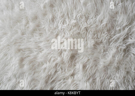 Photo of a Sheepskin wool rug closeup for background (selective focus) Stock Photo