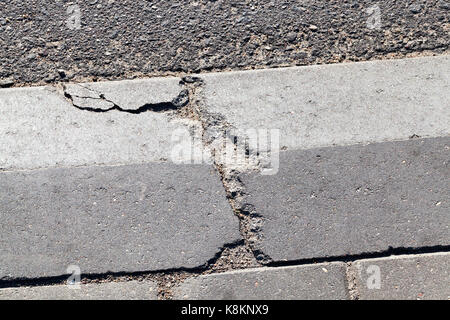 broken concrete curb near the roadway. photo close-up in the city Stock Photo