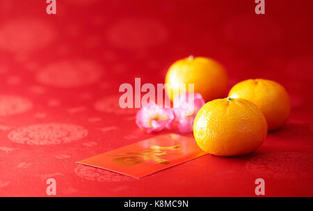 Chinese New Year - Mandarin orange and red packet Stock Photo
