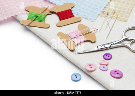 Needle and thread with other sewing tools and accessories Stock Photo