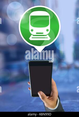 Digital composite of Hand holding phone with train icon in city Stock Photo