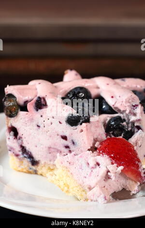 Cold cheesecake with blueberry and strawberry Stock Photo