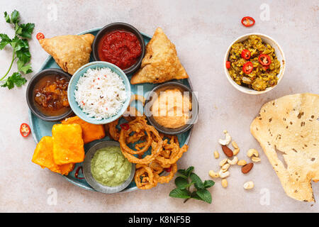 Indian vegetarian thali  with jeera  rice, different snacks and dips. Top view, blank space Stock Photo