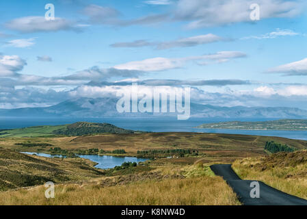 Early Morning Light & Shadow over Arran Hills with the clouds reflected on the majestic mountains Arran. Stock Photo