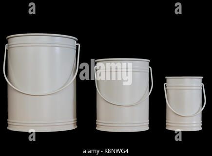 Three light grey buckets with handles. The buckets are enamelled and isolated on a black back ground. Stock Photo