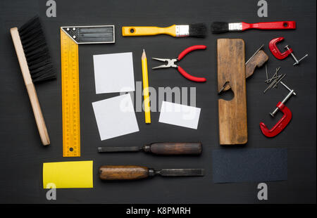 Top View of Assorted Woodwork and Carpentry Tools on Pine Wood Texture Background. Stock Photo