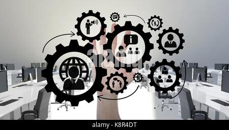 Digital composite of Hand interacting with people in cogs graphics against office background Stock Photo