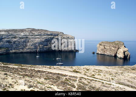 Sailing yachts at anchor in Dwejra bay, San Lawrenz, Gozo, Malta Stock Photo