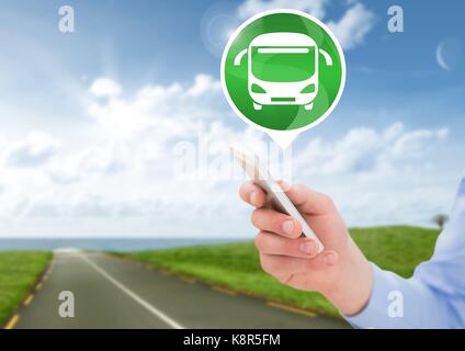 Digital composite of Hand holding phone with bus icon on road Stock Photo