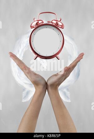 Digital composite of Business woman holding a clock against background with clock Stock Photo