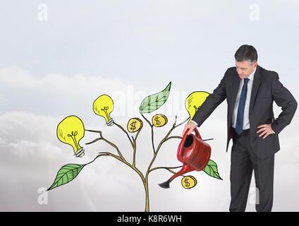 Digital composite of Man holding watering can and Drawing of Money and idea graphics on plant branches on wall Stock Photo