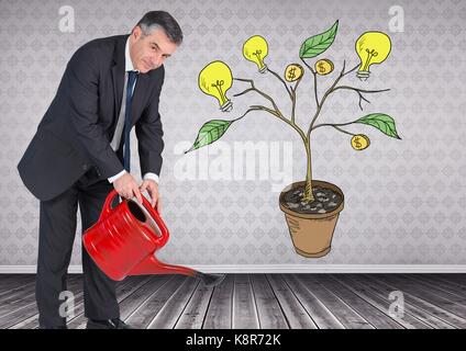 Digital composite of Man holding watering can and Drawing of Money and idea graphics on plant branches on wall Stock Photo