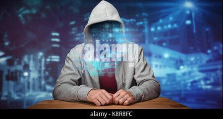 Robber sitting at table against high angle view of crowded buildings in city Stock Photo