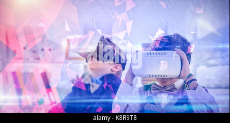 Dark abstract design against business people wearing virtual reality headsets Stock Photo