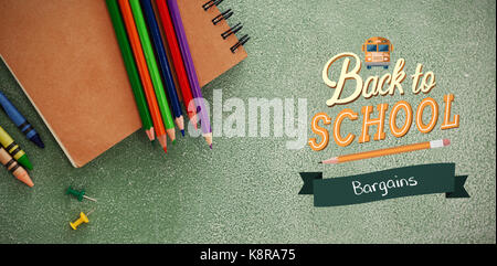 back to school against high angle view of colored pencils with book Stock Photo