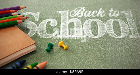 Back to school text against white background against pencils with thumbtacks and book Stock Photo