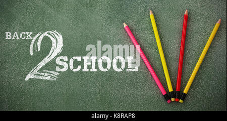 Back to school text on white background against overhead view of pencils Stock Photo