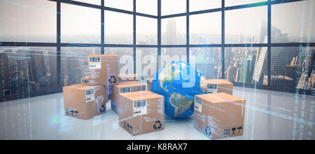 Globe with cardboard boxes against room with large window showing city Stock Photo