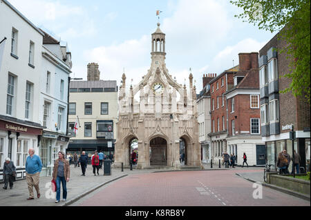 People walking along West Street and in front of the Market Cross in the city of Chichester, West Sussex, England. Stock Photo