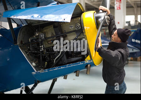 Mechanic working on plane Stock Photo