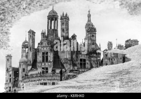 Chateau de Chambord, the largest chateau in the Loire Valley, reflected in the puddle, Loir-et-Cher, France Stock Photo