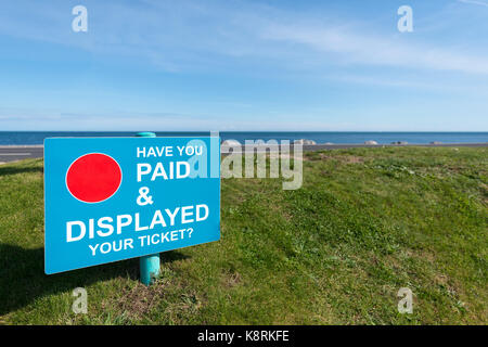 Roadside 'Paid and Displayed Sign at Slapton Sands Car Park, Torcross, Devon - UK Stock Photo