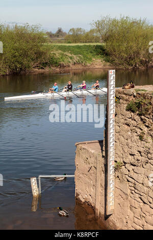 WATER GAUGE ON RIVER WYE WITH SCULLING BOAT. Stock Photo