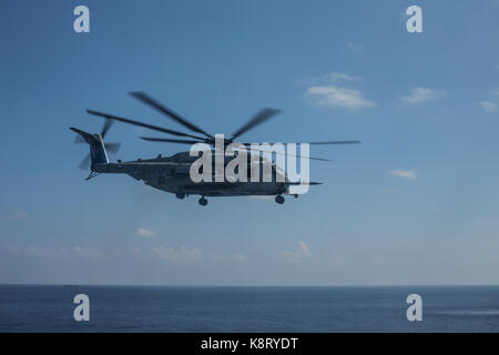 A U.S. Marine Corps CH-53E Super Stallion with Marine Heavy Helicopter Squadron (HMH) 461, flies near the coast of Key West, Fla., Sept. 17, 2017. Stock Photo