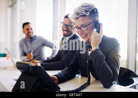 Portrait of busy female architect talking on phone Stock Photo