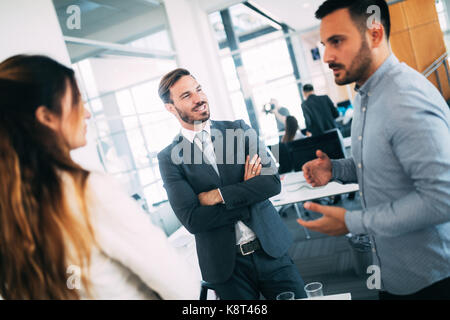 Team of architects working on construction plans Stock Photo