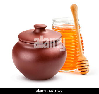Clay Honey pot and glass jar isolated on white background with clipping path Stock Photo