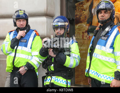 Metropolitan police and the public during an anti-austerity march. Stock Photo