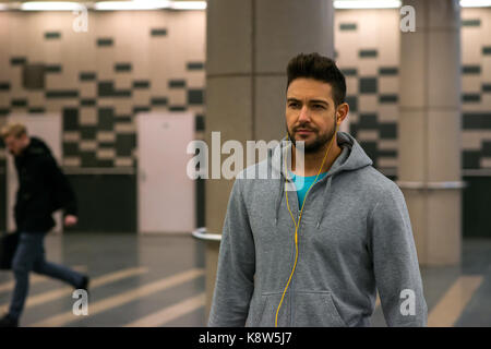 A handsome young sportsman walking in the underground Stock Photo