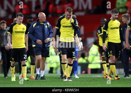 Burton players react after the final whistle during the Carabao Cup, Third Round match at Old Trafford, Manchester. Stock Photo