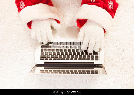 Santa Claus with laptop Stock Photo