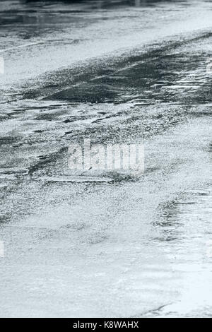 street asphalt road with rain puddles during bad weather Stock Photo
